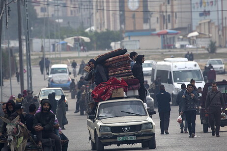 Displaced Palestinians make their way to Rafah after Isralei warnings of increased military operations