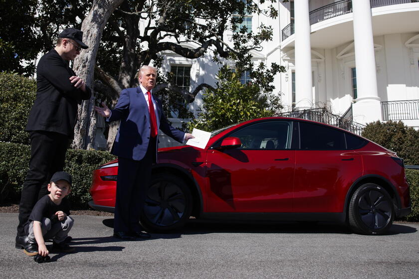 US President Trump views Tesla vehilces in front of the White House